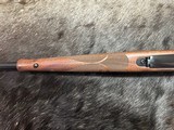 FREE SAFARI, NEW WINCHESTER MODEL 70 FEATHERWEIGHT 300 WIN MAG RIFLE 22