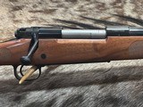 FREE SAFARI, NEW WINCHESTER MODEL 70 FEATHERWEIGHT 300 WIN MAG RIFLE 22