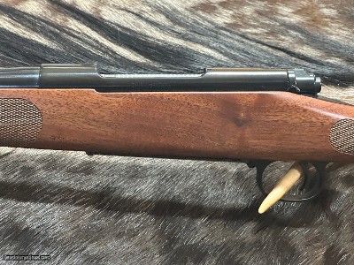 FREE SAFARI, NEW WINCHESTER MODEL 70 FEATHERWEIGHT 300 WIN MAG RIFLE 24