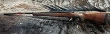 FREE SAFARI, NEW WINCHESTER MODEL 70 FEATHERWEIGHT 300 WIN MAG RIFLE 22