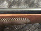 FREE SAFARI, NEW WINCHESTER MODEL 70 FEATHERWEIGHT 300 WIN MAG RIFLE 22