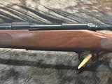 FREE SAFARI, NEW WINCHESTER MODEL 70 FEATHERWEIGHT 300 WIN MAG RIFLE 22