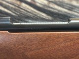 FREE SAFARI, NEW WINCHESTER MODEL 70 FEATHERWEIGHT 300 WIN MAG RIFLE 22