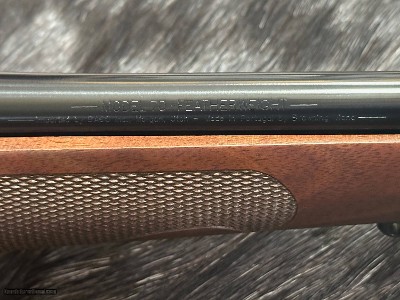 FREE SAFARI, NEW WINCHESTER MODEL 70 FEATHERWEIGHT 300 WIN MAG RIFLE 24