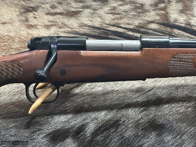 FREE SAFARI, NEW WINCHESTER MODEL 70 FEATHERWEIGHT 300 WIN MAG RIFLE 24