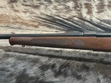 FREE SAFARI, NEW WINCHESTER MODEL 70 FEATHERWEIGHT 300 WIN MAG RIFLE 22