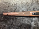 FREE SAFARI, NEW WINCHESTER MODEL 70 FEATHERWEIGHT 300 WIN MAG RIFLE 22