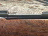 FREE SAFARI, NEW WINCHESTER MODEL 70 FEATHERWEIGHT 300 WIN MAG RIFLE 22
