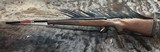 FREE SAFARI, NEW WINCHESTER MODEL 70 FEATHERWEIGHT 300 WIN MAG RIFLE 22