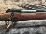 FREE SAFARI, NEW WINCHESTER MODEL 70 SUPER GRADE 338 WIN MAG 26