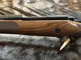 FREE SAFARI, NEW WINCHESTER MODEL 70 SUPER GRADE FRENCH WALNUT 7MM REM MAG 26