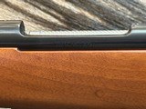 FREE SAFARI, NEW WINCHESTER MODEL 70 FEATHERWEIGHT 264 WIN MAG RIFLE 24