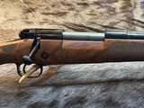 FREE SAFARI, NEW WINCHESTER MODEL 70 SUPER GRADE FRENCH WALNUT 300 WIN MAG 26