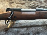 NEW WINCHESTER MODEL 70 SUPER GRADE 300 WIN MAG 26