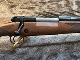 NEW WINCHESTER MODEL 70 SUPER GRADE 300 WIN MAG 26