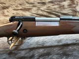 NEW WINCHESTER MODEL 70 SUPER GRADE 300 WIN MAG 26