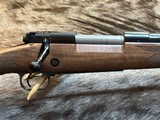 NEW WINCHESTER MODEL 70 SUPER GRADE 300 WIN MAG 26