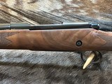 NEW WINCHESTER MODEL 70 SUPER GRADE 300 WIN MAG 26