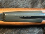 NEW WINCHESTER MODEL 70 SUPER GRADE 300 WIN MAG 26