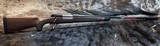 NEW WINCHESTER MODEL 70 SUPER GRADE 300 WIN MAG 26