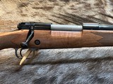 NEW WINCHESTER MODEL 70 SUPER GRADE 300 WIN MAG 26
