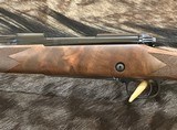 NEW WINCHESTER MODEL 70 SUPER GRADE 338 WIN MAG 26