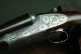 Boss 12 Bore Sidelock Ejector – Rare Round Body Action with Boss Patent Single Trigger and Sumner Engraving - 1 of 10