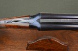 Winchester Model 21 Trap Grade
–
Highly Figured Wood with Roll Over Monte Carlo Custom Stock - Excellent - 8 of 10