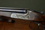 Merkel 147EL 20 Gauge Boxlock Ejector with 30” Barrels, Highly Figured Stock and Long Length of Pull – Profusely Game Scene Engraved by Bettina Lenk - 2 of 12
