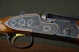 CSMC A-10 American 12 Gauge Sidelock Ejector Shotgun – Exquisite Rose & Scroll Engraving Signed by Richard Roy and Fabulous Case Coloring and Highly F - 1 of 15
