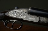 Wm. Richards 12 Bore Sidelock Ejector with Excellent Game Scene and Scroll Engraving – Highly Figured Stock