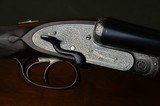 F.T. Baker 12 Bore Sidelock Ejector with Profuse Intricate Engraving and Sidelever Opening – Long Length of Pull – No. 2 of a Pair