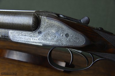 John Rigby “Rising Bite” 12 Bore Sidelock Ejector with Spectacularly Figured 30” Nitro Damascus Barrels and Highly Figured French Walnut Stock – 2-3/4