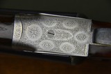 Boss & Co. 12 Bore Sidelock Ejector with 30” Barrels and Full Coverage Sumner Engraving and Highly Figured French Walnut Stock - 2 of 13