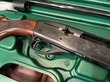 LIKE NEW REMINGTON 1100 410 GAUGE SHOTGUN WITH REMOVABLE REM CHOKE TUBE GUN IS LIKE NEW PERFECT ALL AROUND COMES WITH REMINGTON CASE - 14 of 15