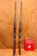 Pair of consecutive Winchester model 12 engraved as shown in the bookof Winchester engraving by R.L. Wilson REDUCED - 2 of 15