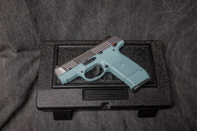 RUGER SR9c 9MM. TURQUOISE POLYMER FRAME & BRUSHED STAINLESS SLIDE