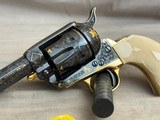 George Spring Master Engraved and Gold Inlaid Colt Single Action Army Sheriff's Model .45colt Checkered Ivory