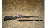 Thompson Center~Encore~.223 REM/.50 Cal - 1 of 11
