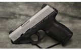 Taurus~PT140~40 S&W - 2 of 4