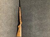 Ruger 10/22 with bull barrel and brown laminate stock