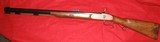 THOMPSON CENTER 56 CALIBER SMOOTHBORE PERCUSSION RIFLE - 1 of 12