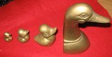 set of four cast brass ducks