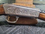 Browning SA-22 FIRST YEAR, GRADE II, Very dramatic embellishment.Drum sight of course, Nice condition. - 2 of 15