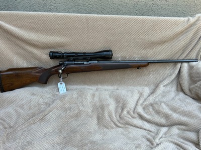 Pre 64 Winchester Model 70 243 in Featherweight, 22barrel with Bausch and Lomb scope with Kuharsky mount.