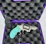 Taurus 38 Special 5 shot revolver Black and Baby Blue Grips - 2 of 3