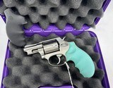 Taurus 38 Special 5 shot revolver Black and Baby Blue Grips - 3 of 3