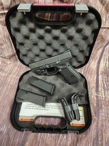 GLOCK G19 Gen 4 w/ TruGlo Sights and Crimson Trace Green Laser - 1 of 7