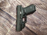 GLOCK G19 Gen 4 w/ TruGlo Sights and Crimson Trace Green Laser - 2 of 7