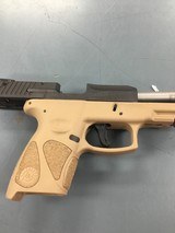 TAURUS INTERNATIONAL MFG., INC. Taurus PT-111 Millenium 9mm Two-Tone - 1 of 2